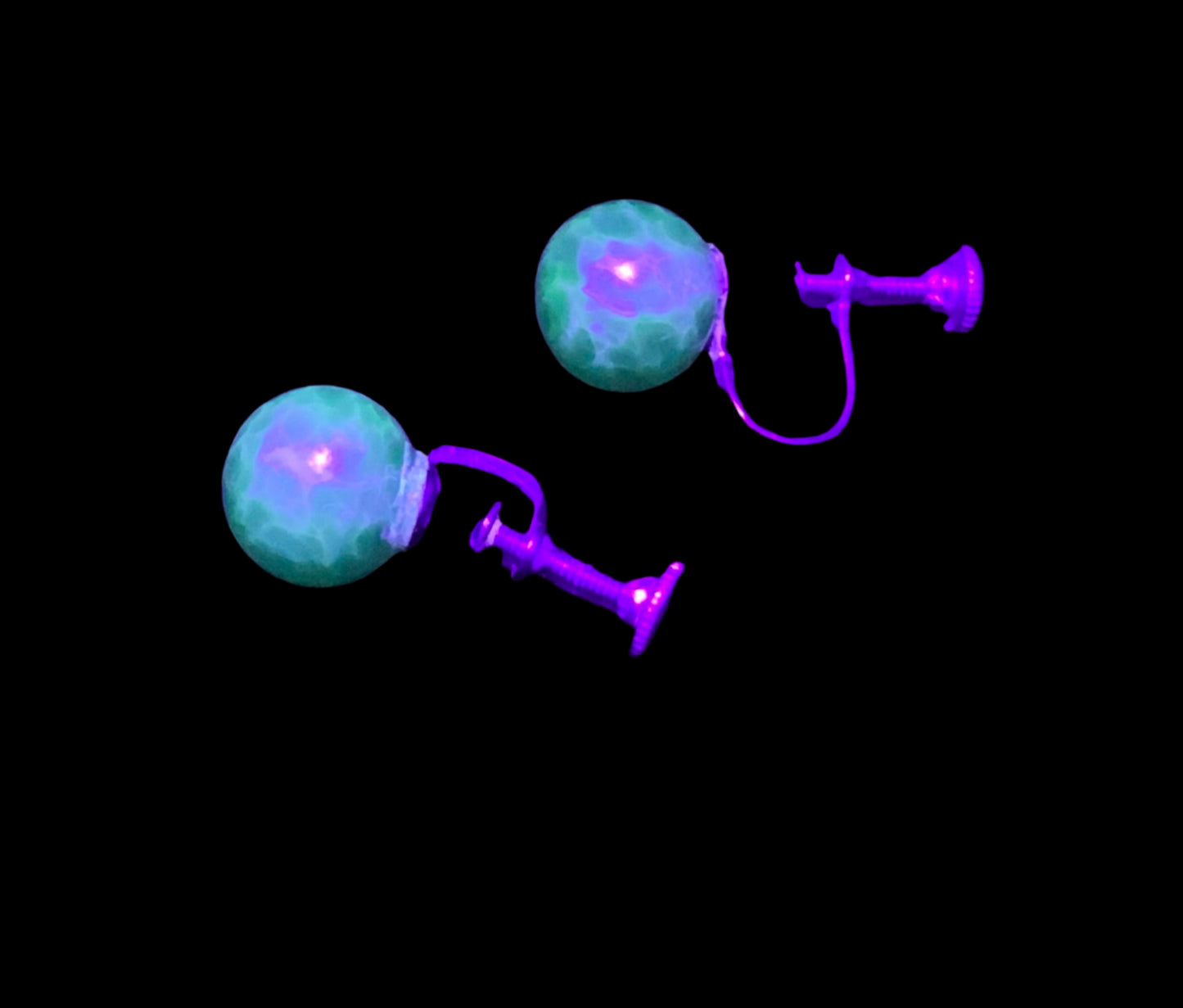 Ug glass earrings under uv light