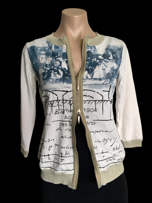 Mannequin wearing a white jacket with artistic design on a plain background